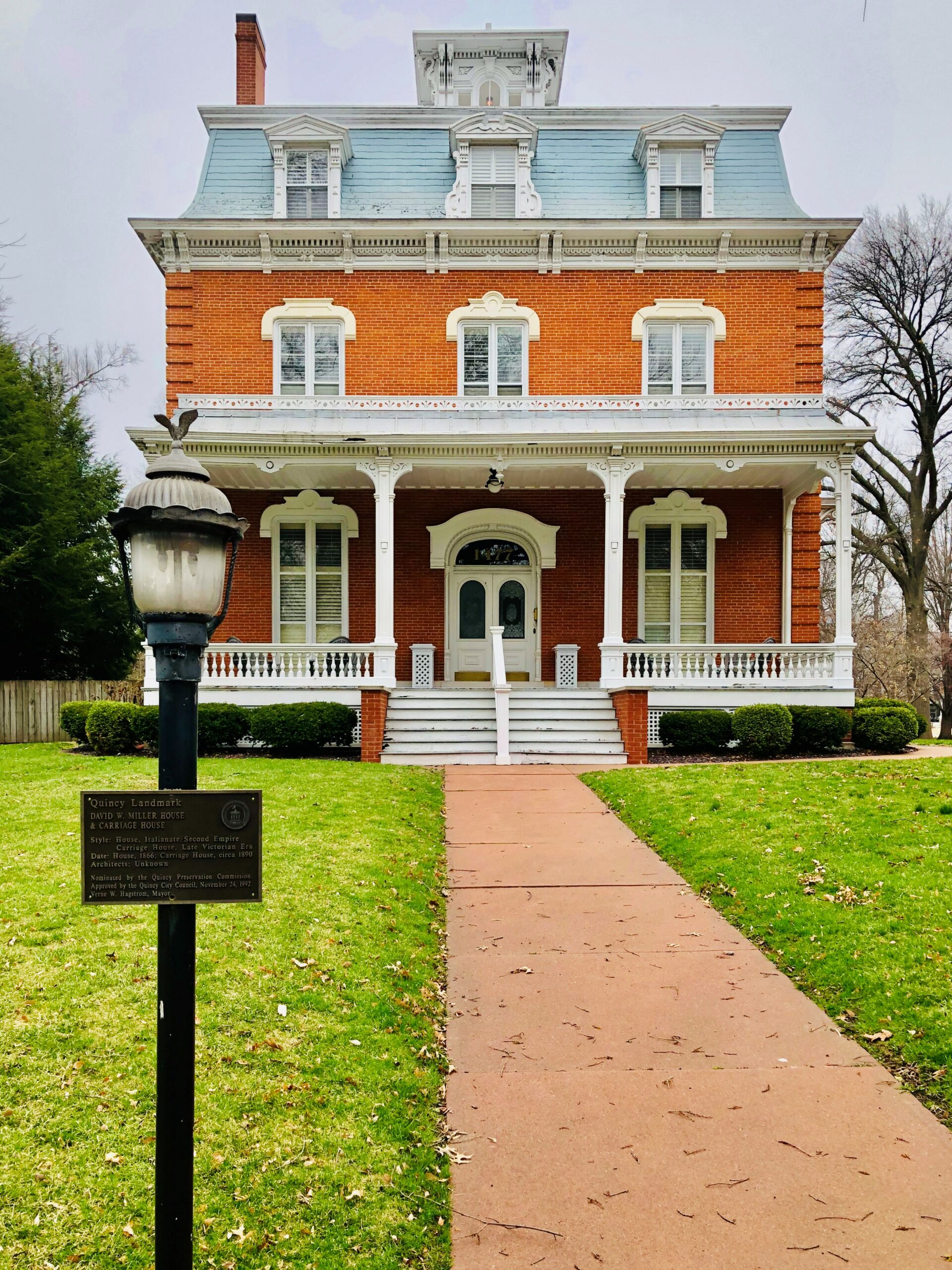 historic brick home/lantern with plaque